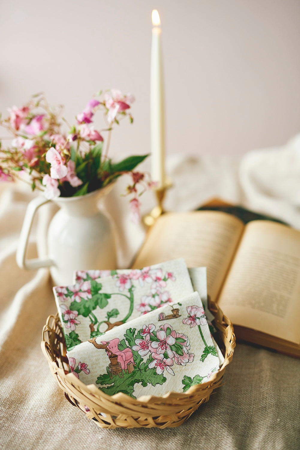 Havi Pelagonia Paper Napkins folded over in a wicker basket