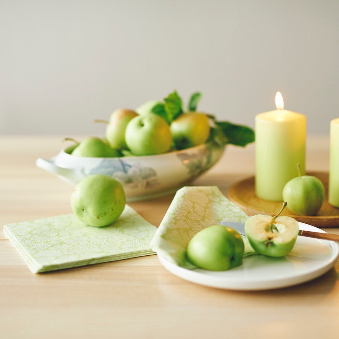 Tablescape of Havi Green Candles, green napkins and green apples