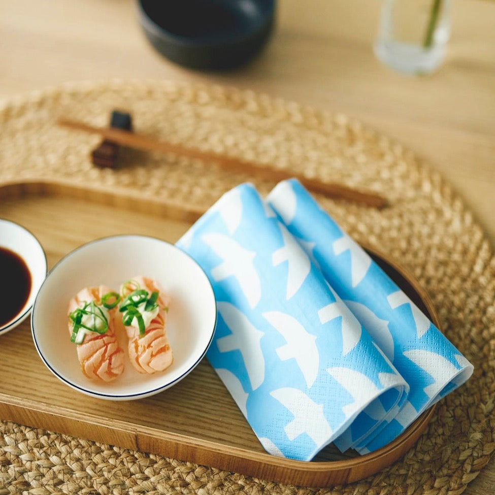 Folded Blue and White Havi Paper Napkin.   White birds on a blue background design