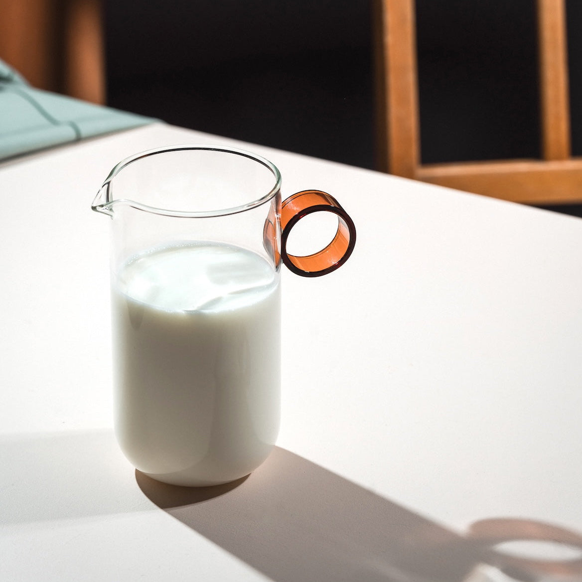 Milk Pitcher on a table with shadows. Loop by Muurla Design