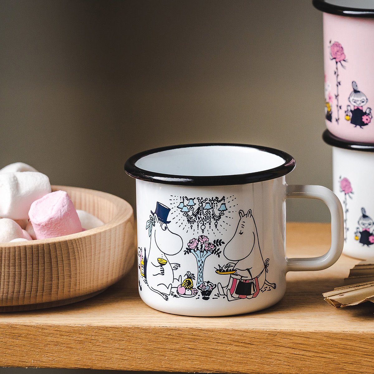 Muurla Moomin Date Night Mug 37cl, shown on a shelf with a bowl of Marshmallows to one side.