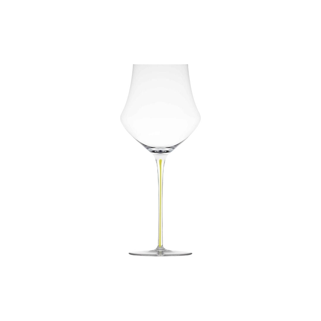A clear Memento glass wine glass with a wide, rounded bowl and a long, slender yellow stem on a plain white background.