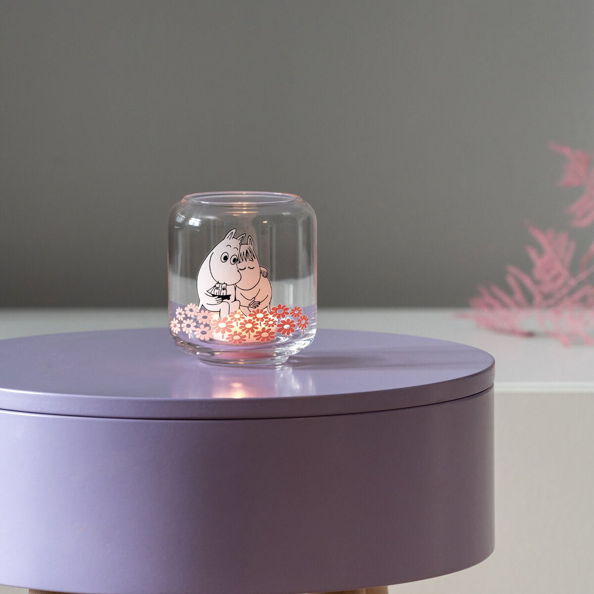 Muurla Moomin Together Tealight Holder / Mini Vase.  shown with a lit tea light inside on a lilac table