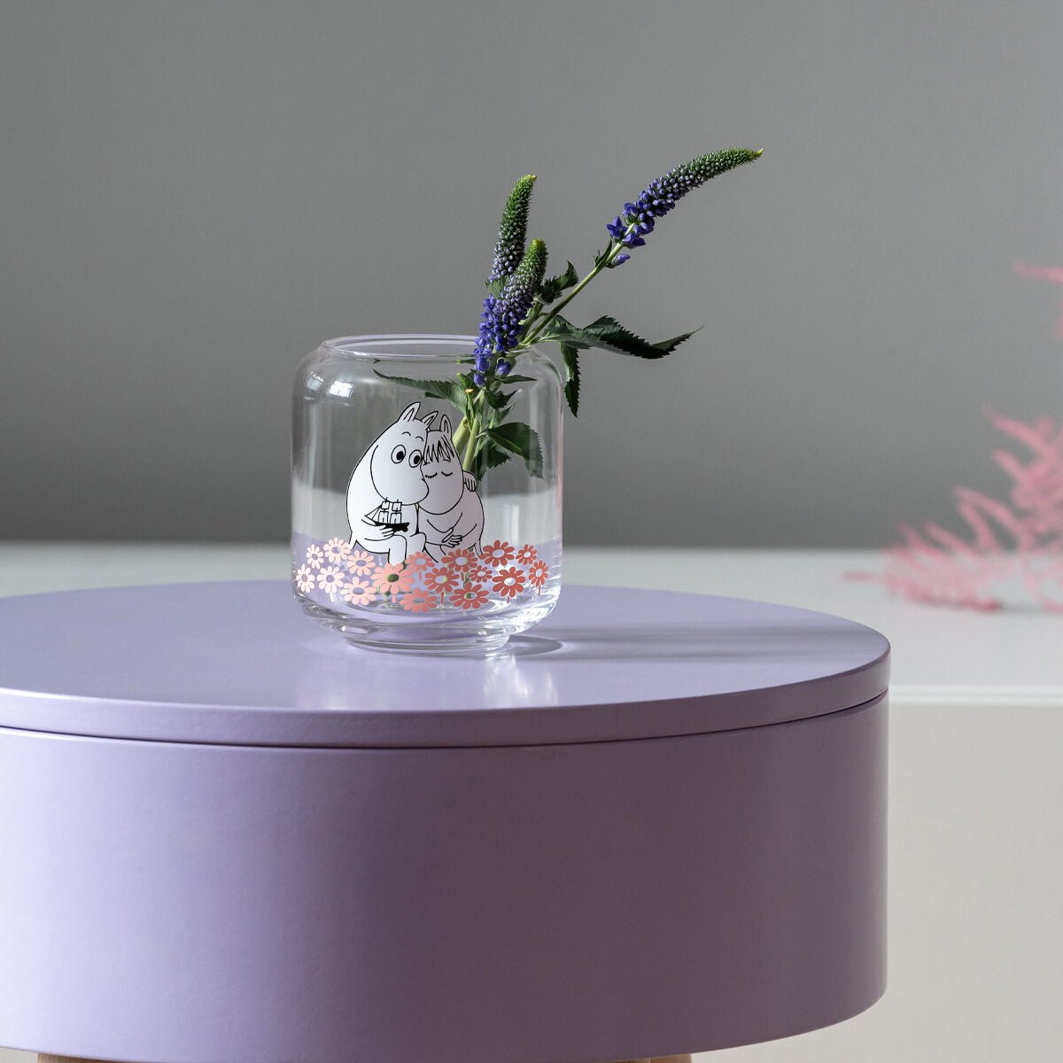 Muurla Moomin Together Tealight Holder / Mini Vase.  shown with a lit tea light inside on a lilac table