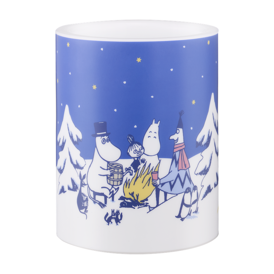 LED Candle with a Moomin winter design on a table with cinnamon sticks and pine cones.