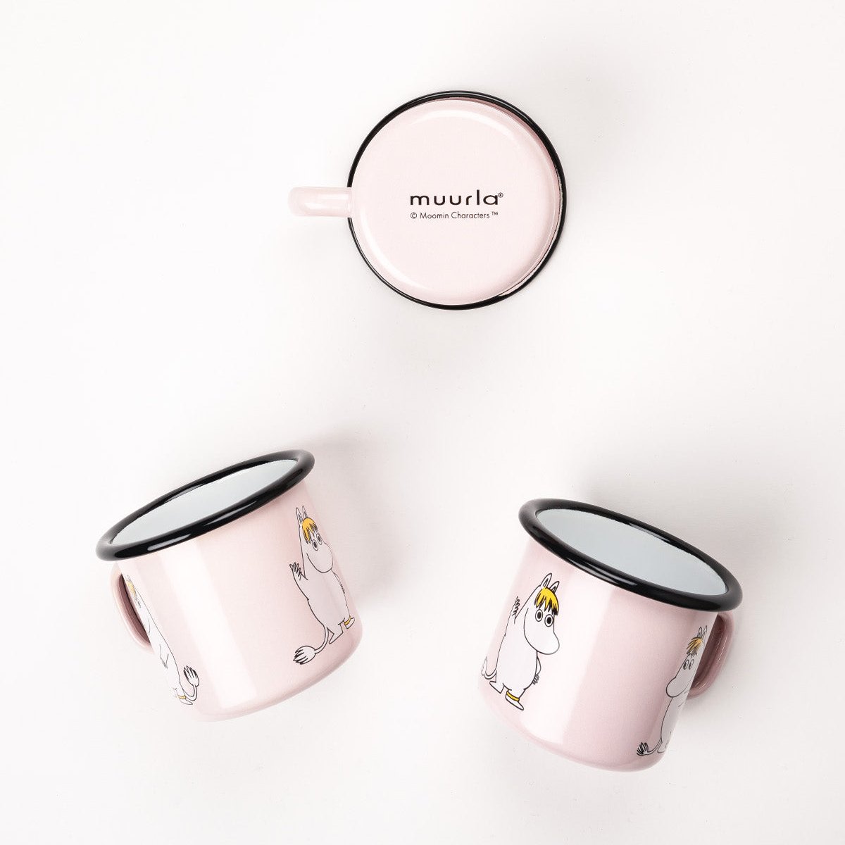 Snorkmaiden Enamel Mug and Bowl pictures next to a pink blanket and flower petals.  Moomin Retro Series of Enamelware by Muurla Design