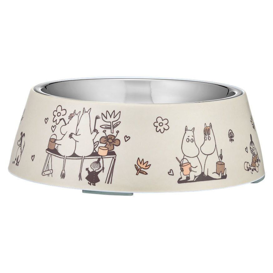 Beige pet bowl with Moomin Moments characters and floral designs on a white background