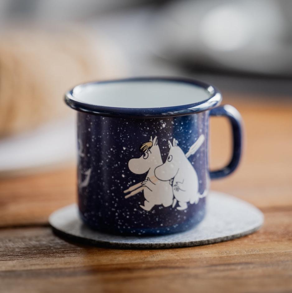 Muurla Moomin Sailors Enamel Mug 0.25L.  White Moomin figures against a deep blue background 