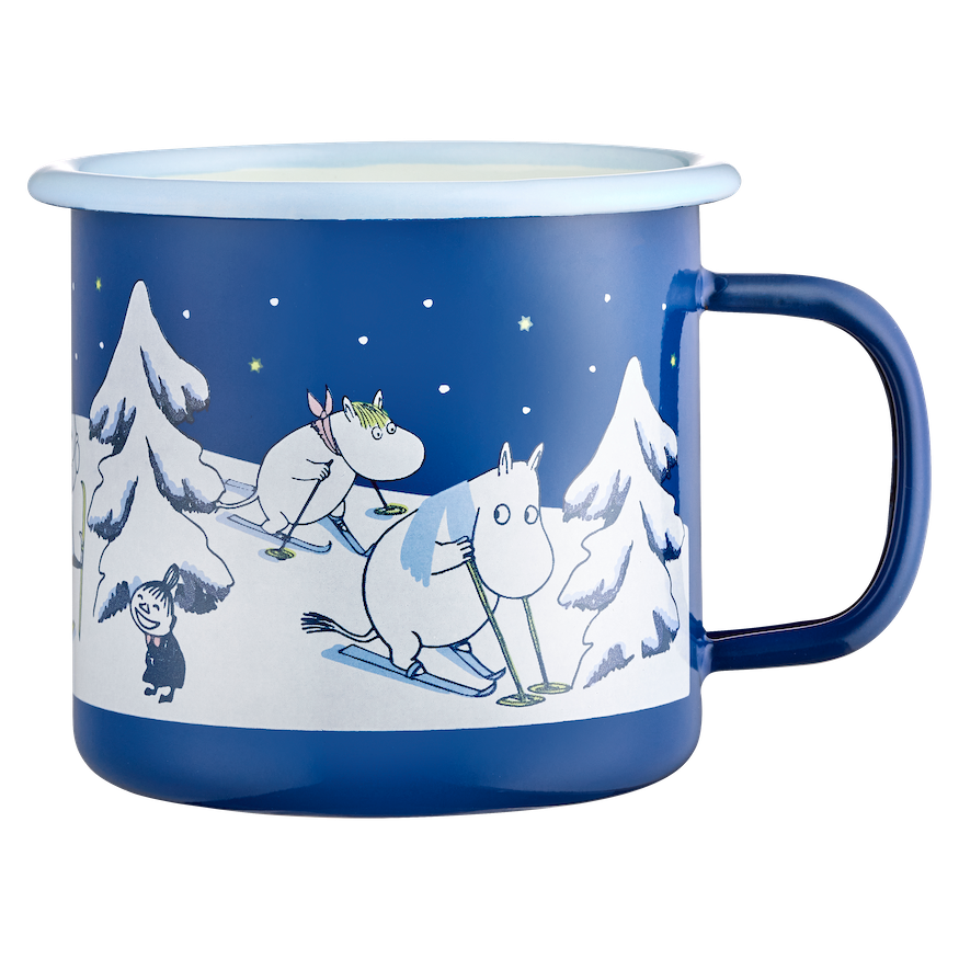 Blue Moomin mug with winter-themed illustration featuring characters and snow-covered trees on a white background