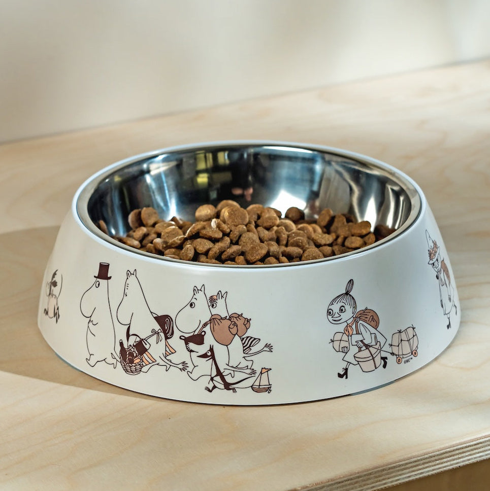 Moomin Dog bowl with Moomin cartoon characters on a wooden surface