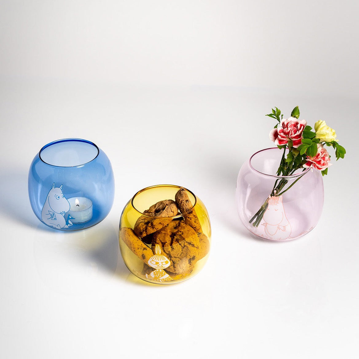 Moomin candleholders by Muurla, full of cookies, candles and flowers