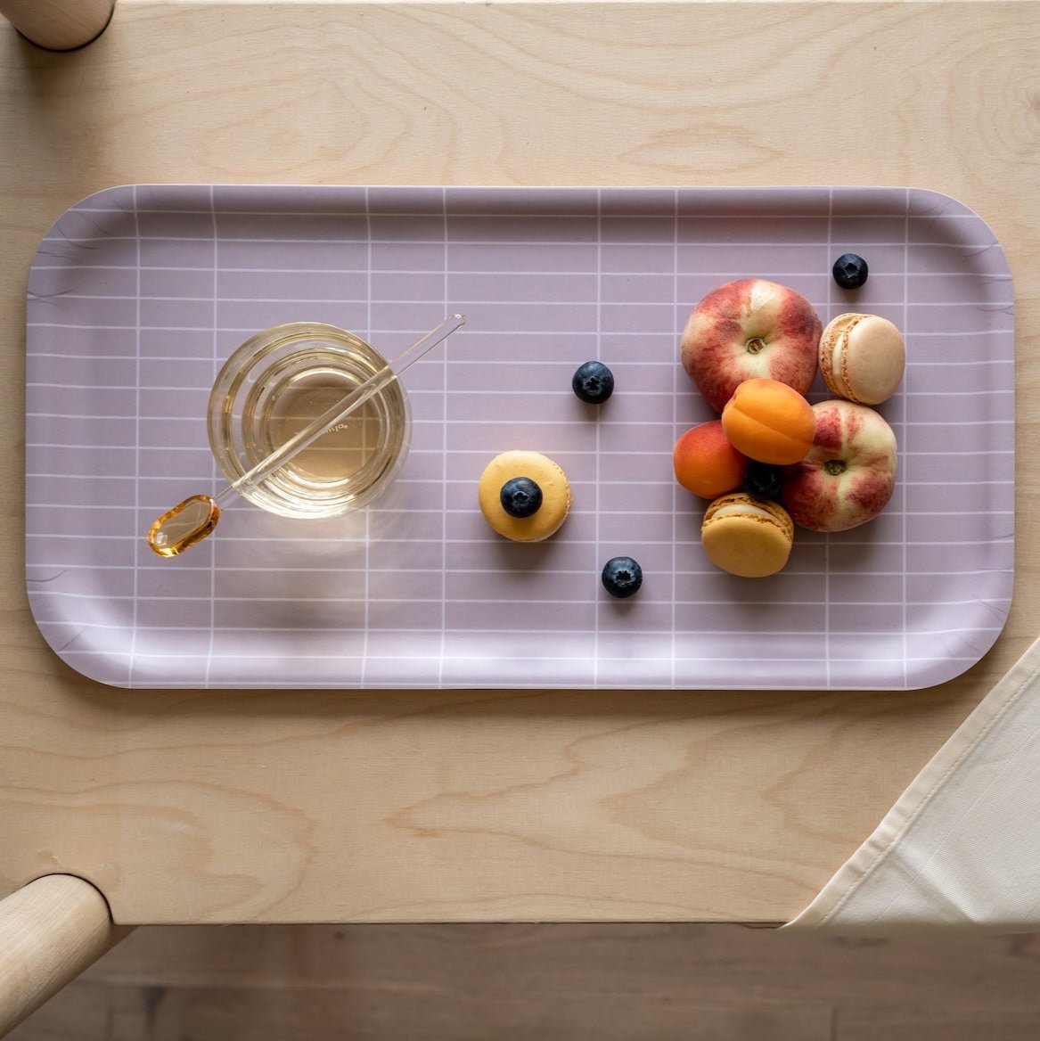 Muurla Checks and Stripes Tray in a Beige Colour.   how with fruit and treats directly on the tray.  Also a fruit drink in a glass