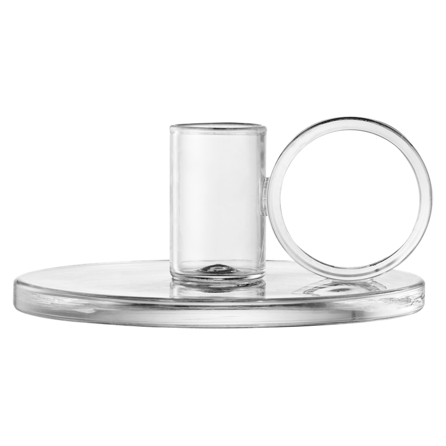 Loop Chamberstick candle holders on a table with books and a tablecloth.  