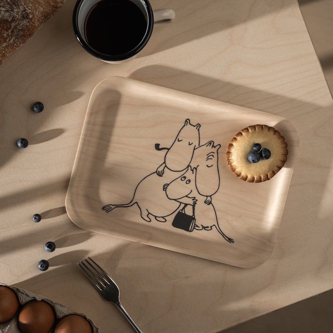 Moomin 80 Tray 27 x 20cm, by Muurla Design.  Shown with a breakfast tart, and eggs and coffee alongside