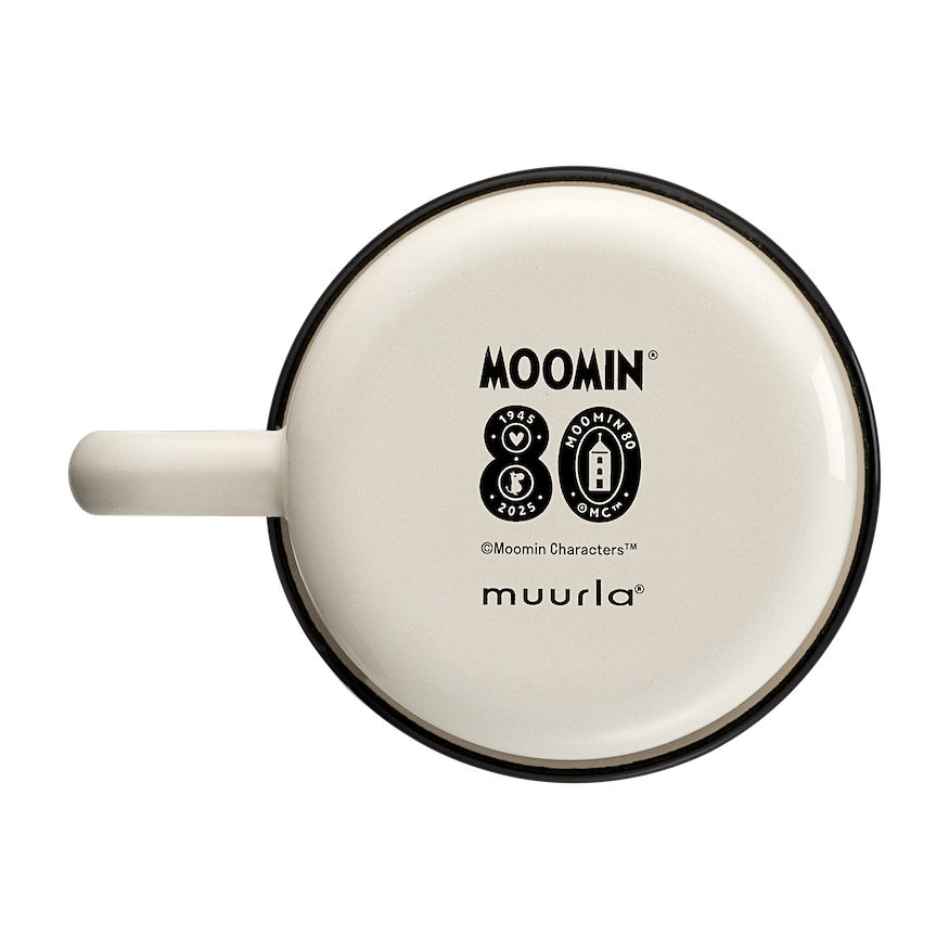 Moomin 80 Enamel Mug by Muurla Design.   Placed on a wooden worktop with bread, berries and a teaspoon next to it