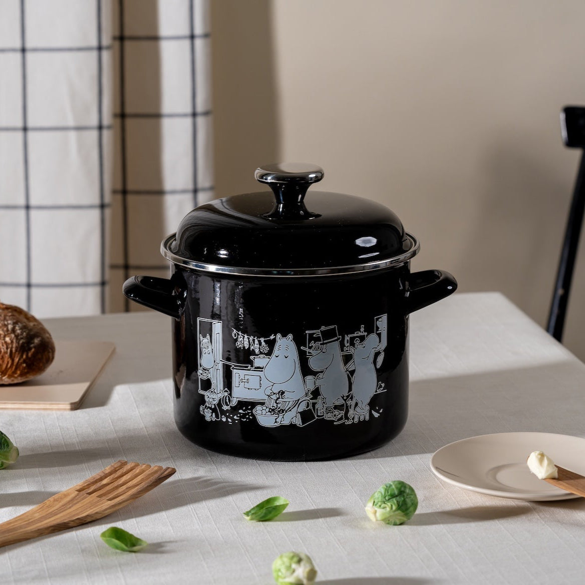 Muurla Moomin 3.5 L Enamel Cooking Pot shown on a dining table next to wooden utensils, bread and sprouts!