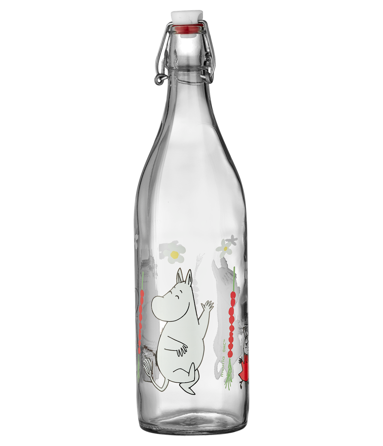 Glass bottle with a Moomin Wild Strawberries design on a table with books and fruits