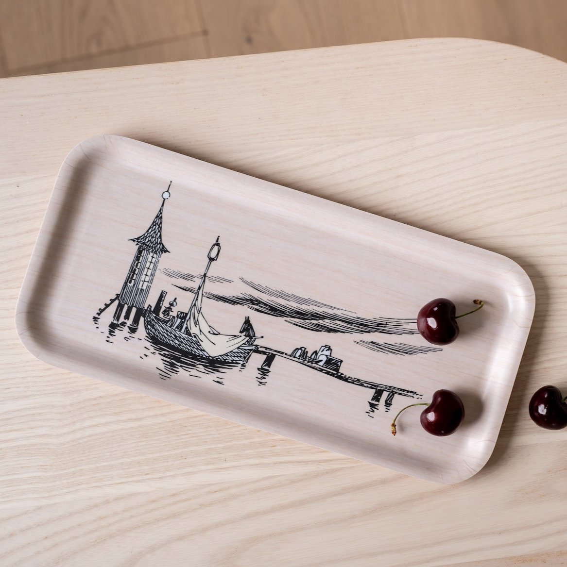 Muurla Moomin The Pier Tray shown with cherries on top.