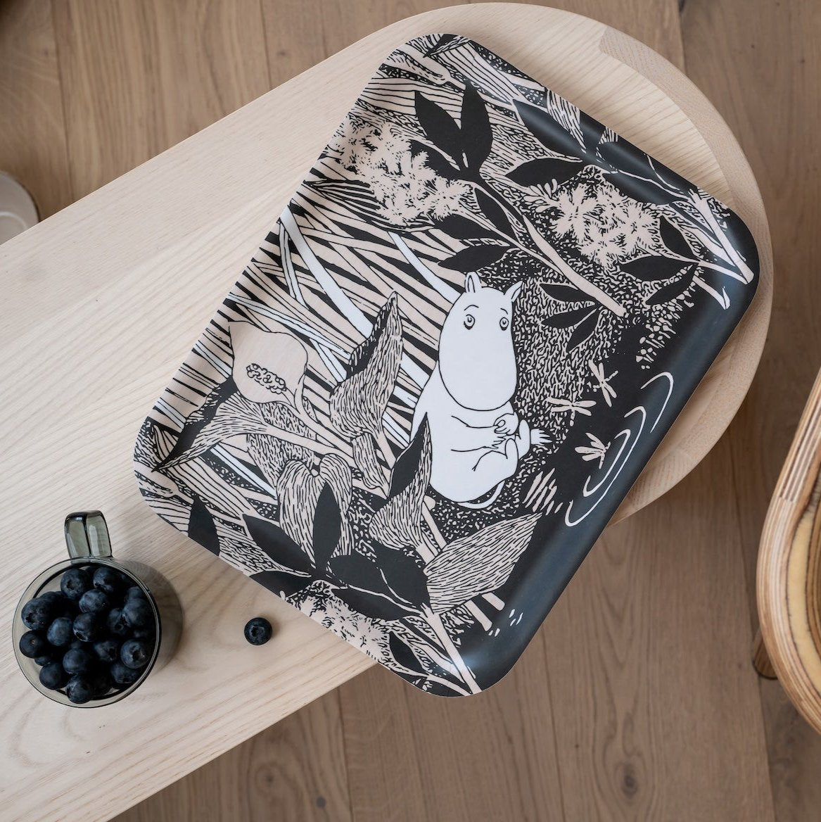 Muurla Moomin The Pound Tray shown on a wooden bench with a cup of olives by the side