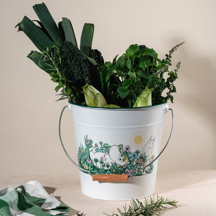 A Moomin Bucket full with herbs and vegetables from the garden.    Muurla Moomin In The Garden Collection