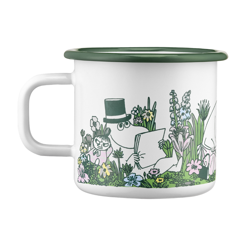 Moomin In the Garden Enamel Mug 0.37 L, pictured by a sprig of Rosemary and a green and white tea towel