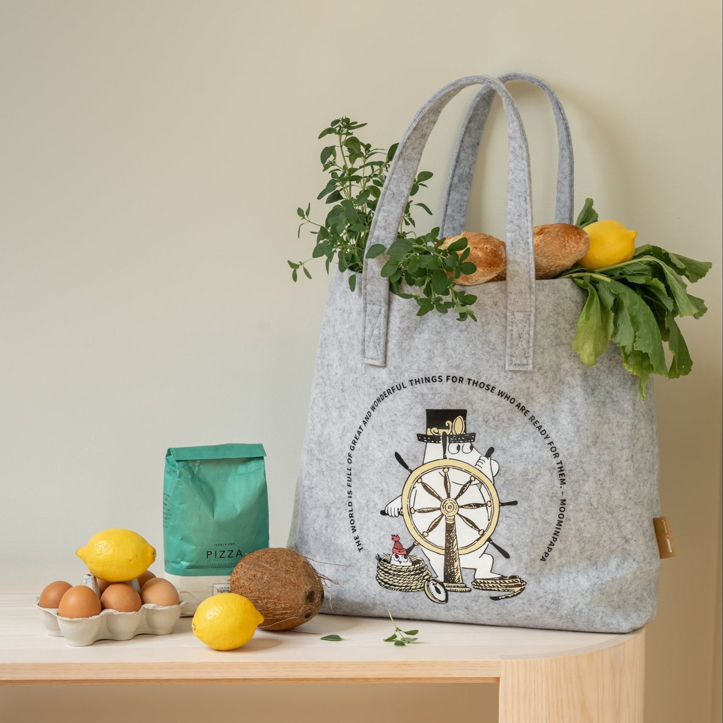 The Adventurer Moomin Tote Bag by Muurla Design, shown full of vegetables, fruit and bread 