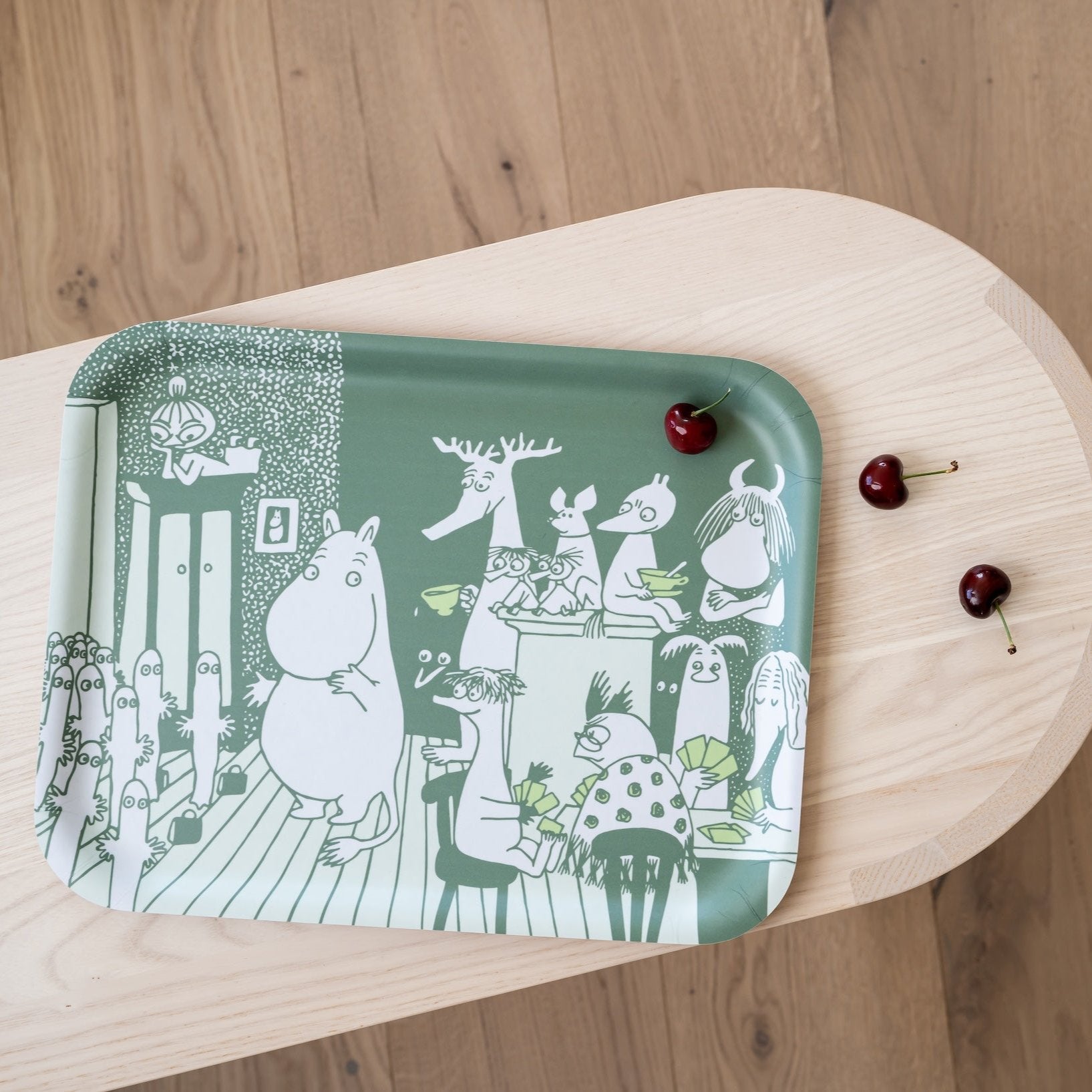 Moomin Tray 'Room For All'  - a white design showing lots of Moomin Characters on a green background. 