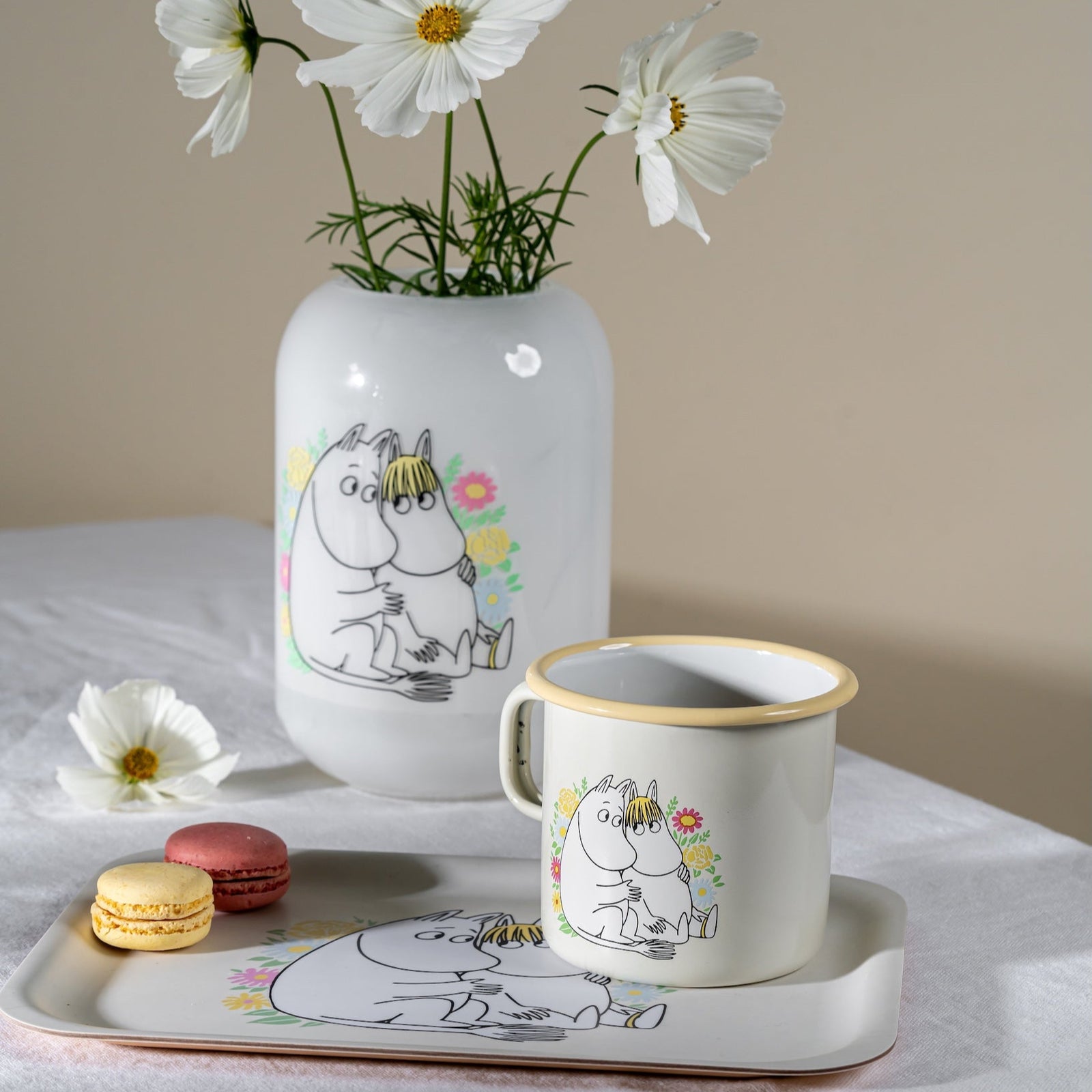 Muurla Moomin Flowers Glass Vase.  White background with a design featuring Moomintroll and Snorkmaiden against backdrop of Flowers