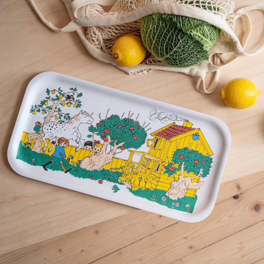 Pippi Longstocking Tray with The Way Home design.  Shown next to a shopping bag with vegetables falling out 