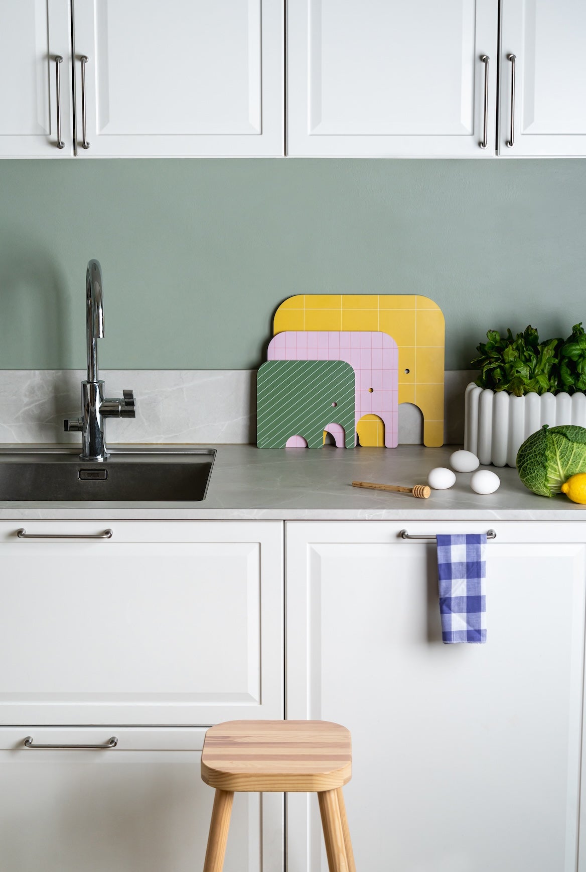 3 sizes of Muurla Design&#39;s Elephant Chop and Serve Boards series.   Sitting together near the sink in a Kitchen setting