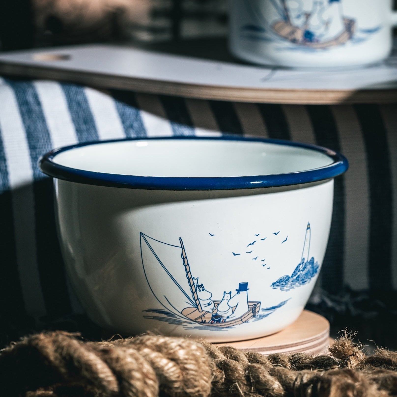 Muurla Moomin Sailors Bowl shown with other pieces in this enamelware collection and nautical props