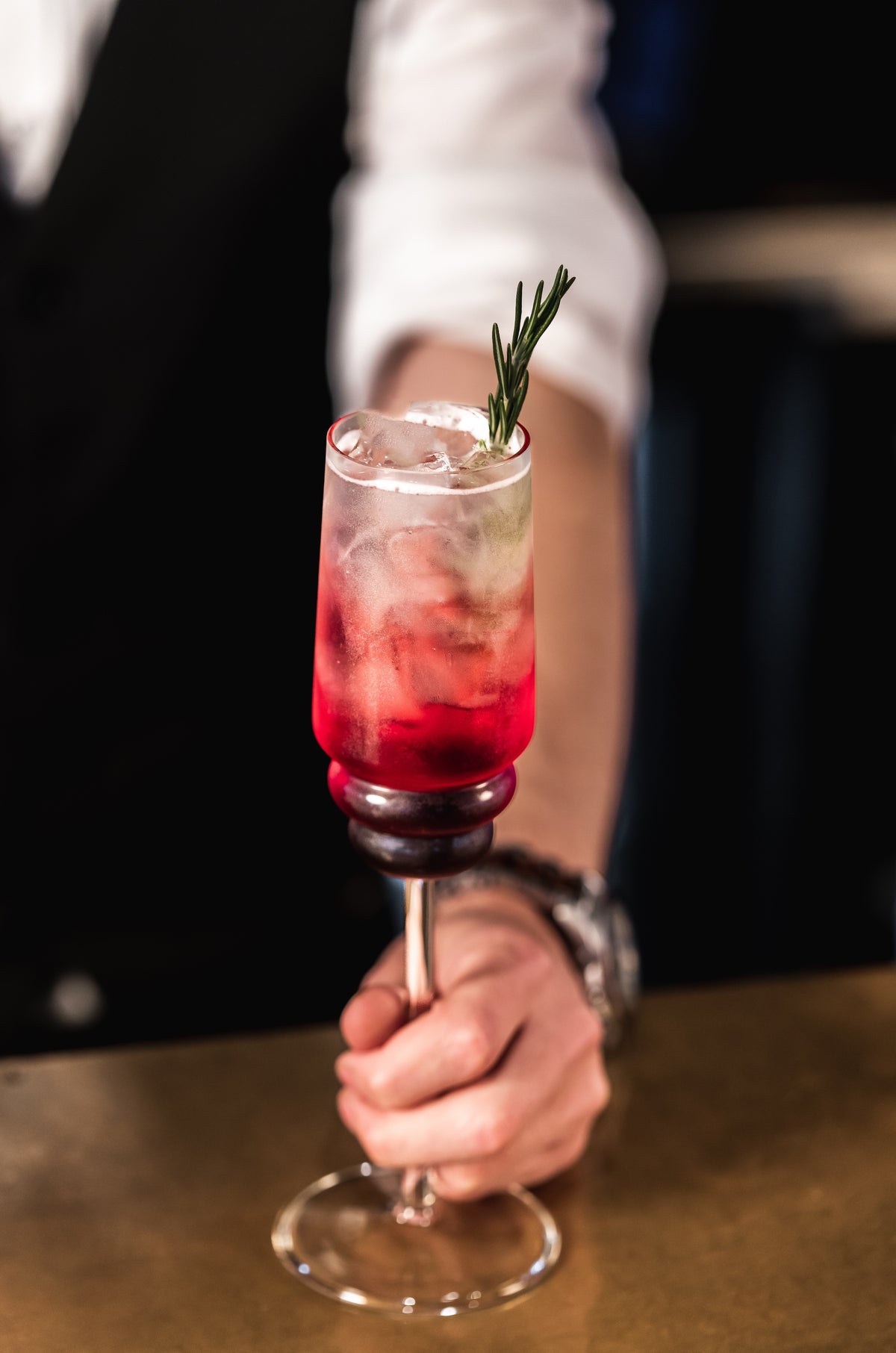 A red Cocktail in a Muurla Design Steps Champagne Glass 