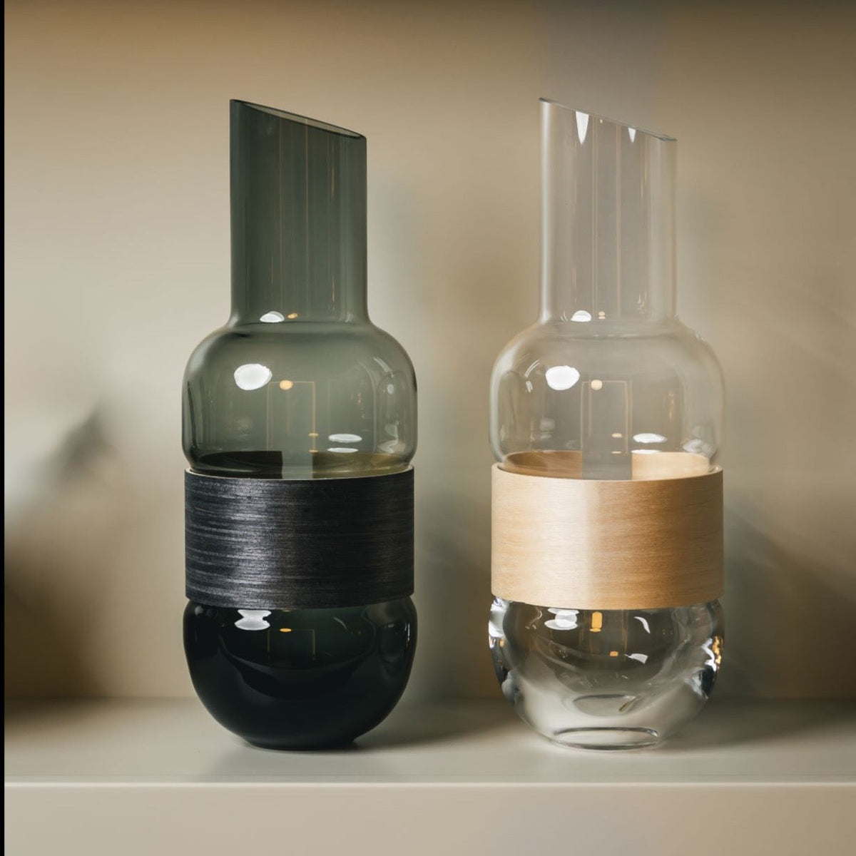 Muurla Design Veneer Pitchers, side by side.   Grey / Charcoal and Clear / Birch