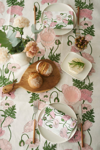 Dinner table laid in a Havi Unikkoaika Poppy design