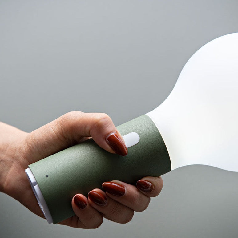 Fermob Aplo Lamp in a lady&#39;s hand.
