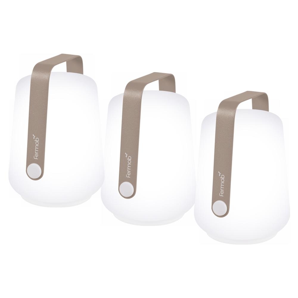 3 Fermob lanterns in Nutmeg on a White background. The lanterns have the Fermob logo on their metal handles.