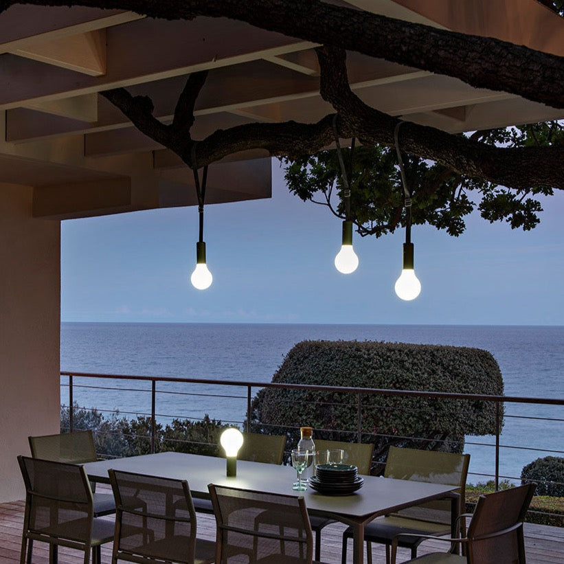 FERMOB | Aplô Suspension Straps over an outdoor dining table