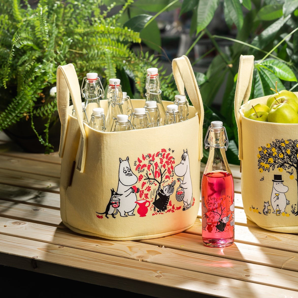 Muurla Moomin Berries Storage Basket next to a berries glass bottle