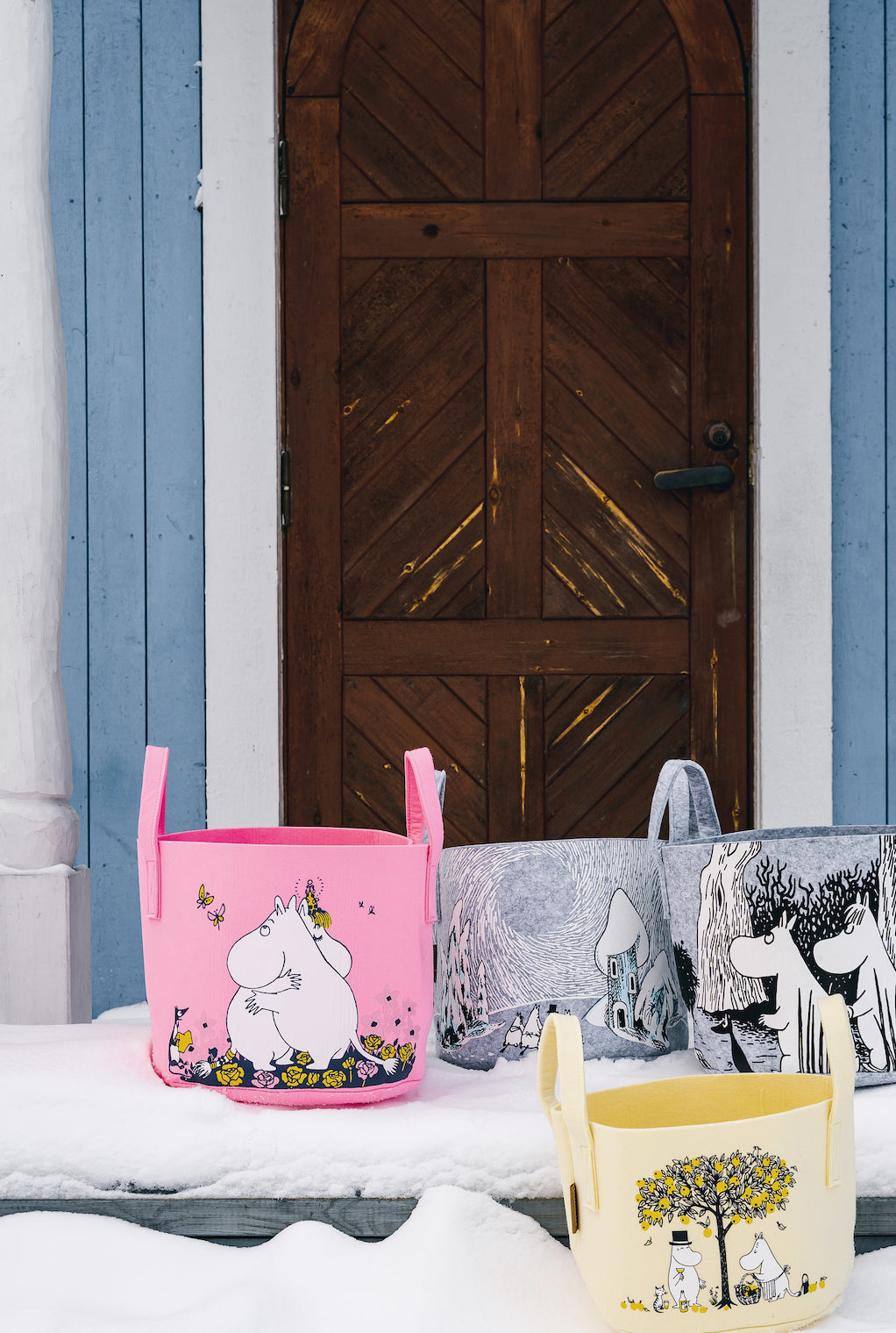 Muurla Design Storage Baskets in Moomin designs, outside in the snow