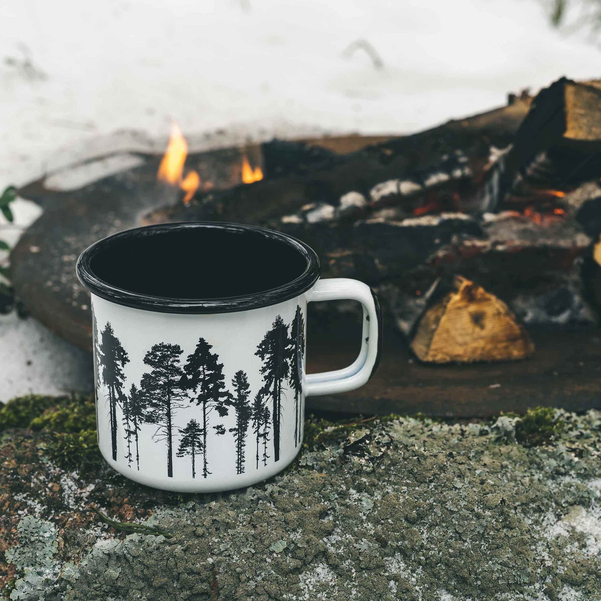 Muurla Design The Forest Enamel Mug, by a fire