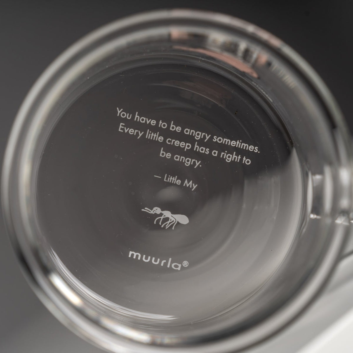 the text on the bottom of Little My Clear Glass mug by Muurla Design