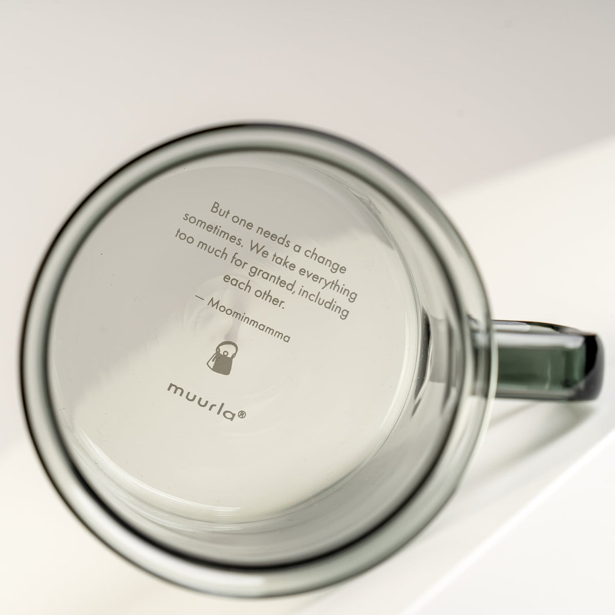 Text on the bottom of a Muurla Moomin Glass Mug in a Moominmamma Design