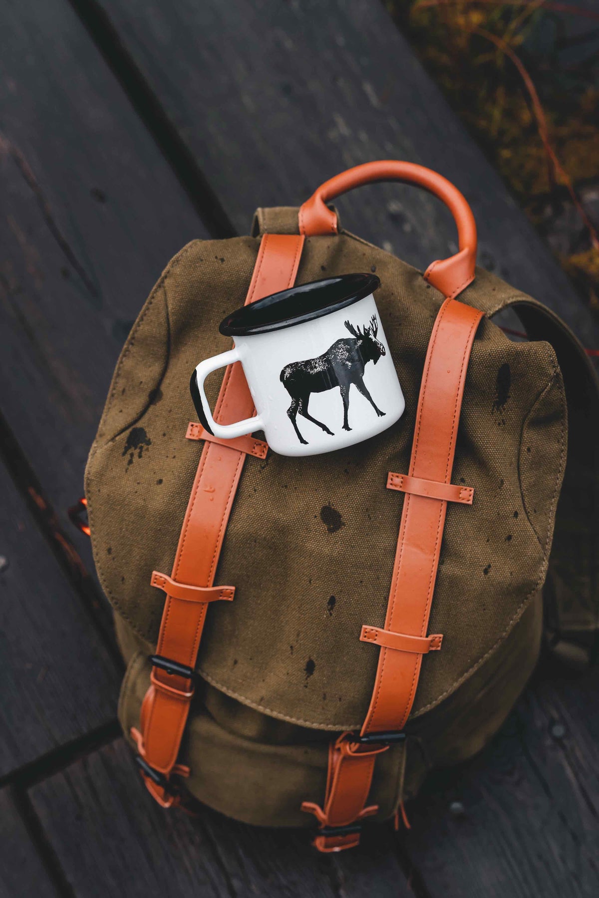 Muurla Design Enamel Mug strapped to a backpack
