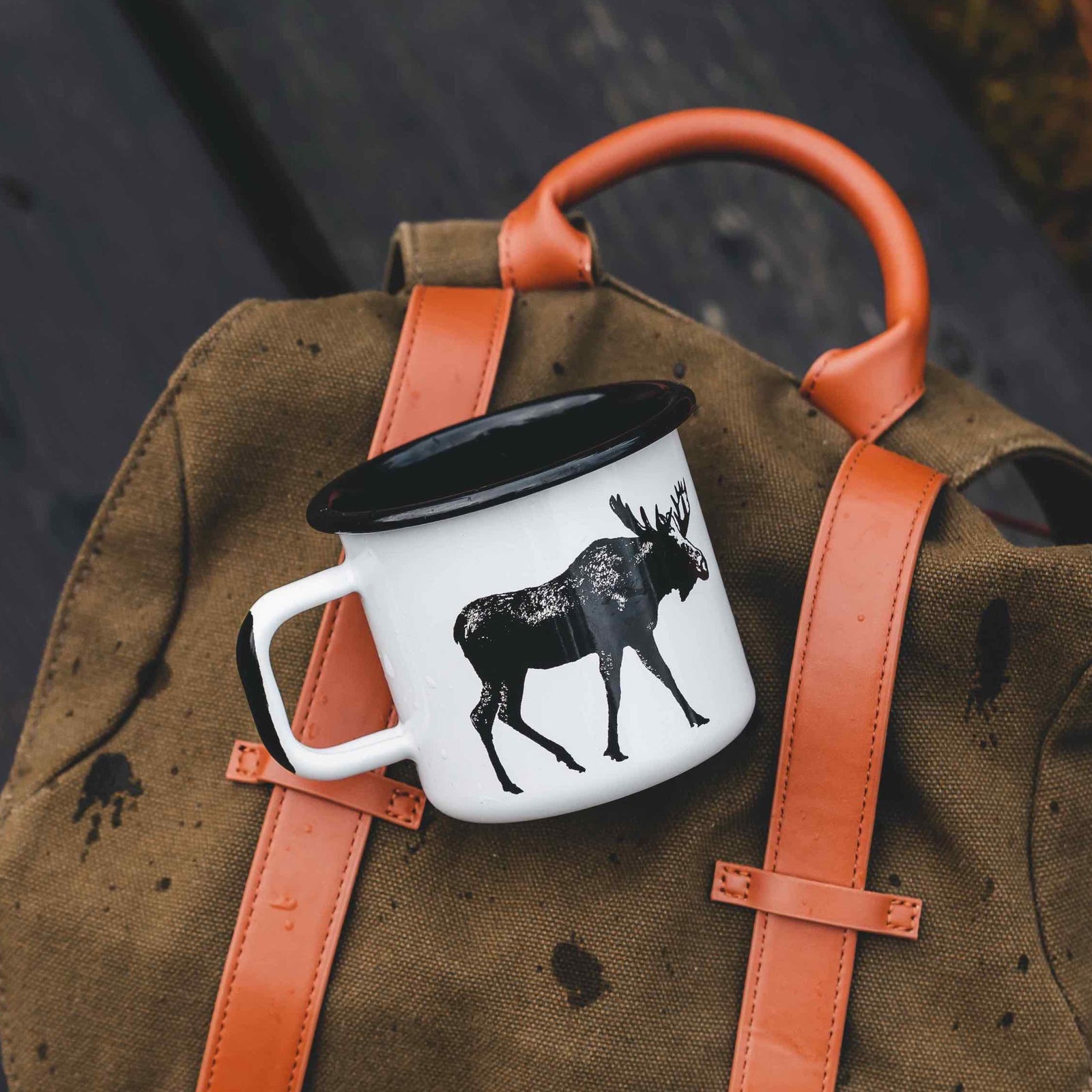 Muurla Design Enamel Mug strapped to a backpack
