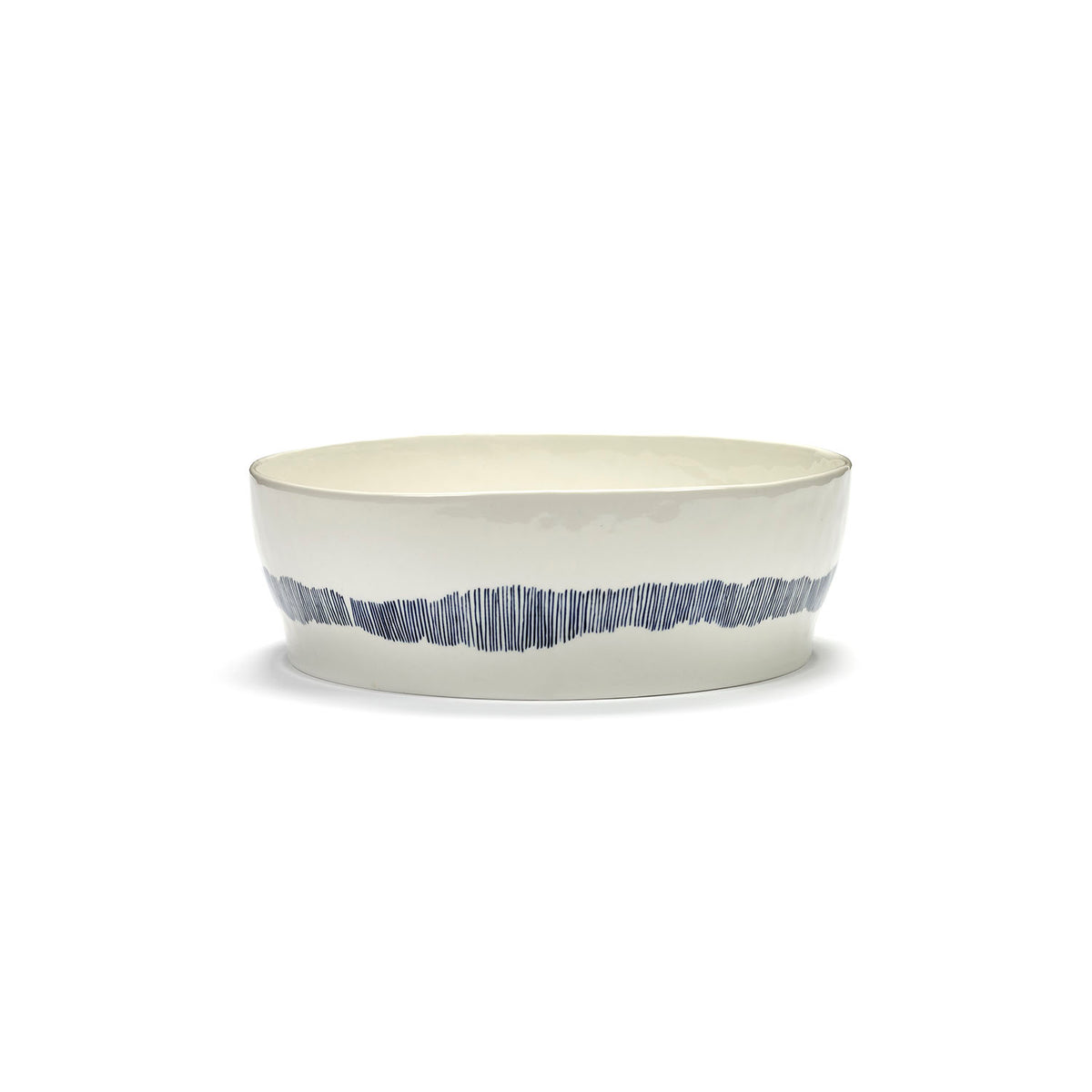 Ottolenghi for Serax Feast collection, side view of salad bowl, with white swirl-stripes blue design.